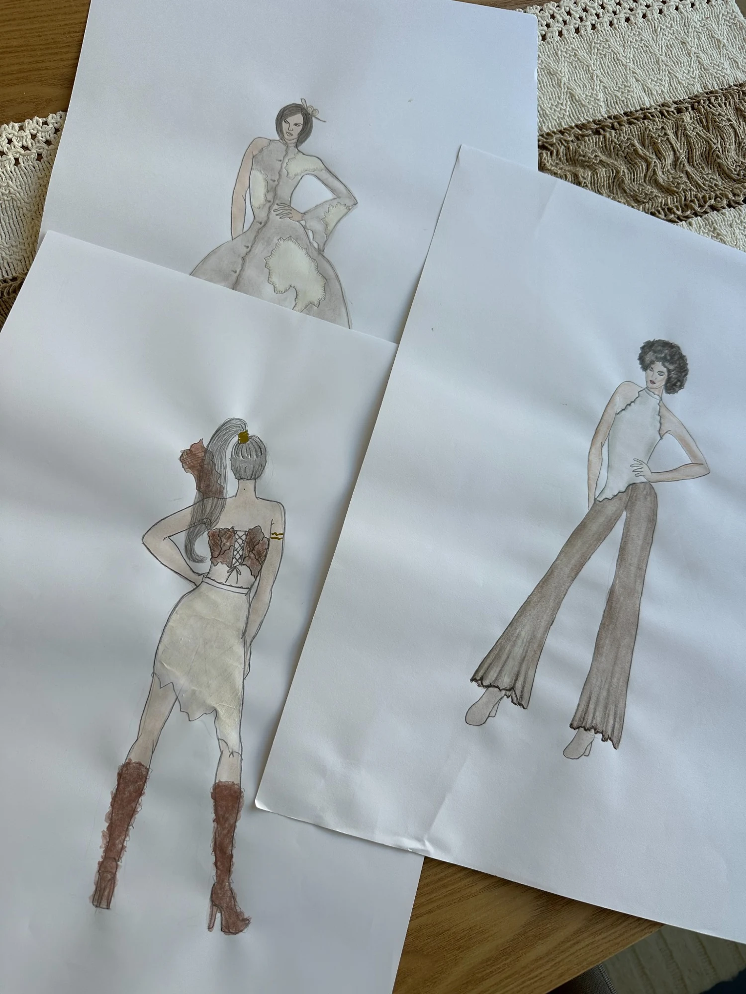 Fashion sketches of three fluid garment silhouettes